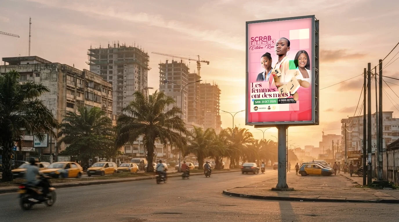 L'affiche Scrab'Elles sur un panneau grand format, boulevard de Douala au coucher du soleil
